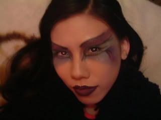 http://i21.photobucket.com/albums/b255/EVILCUNT/MAKEUP/MEWITHPURPLEMAKEUP-1.jpg