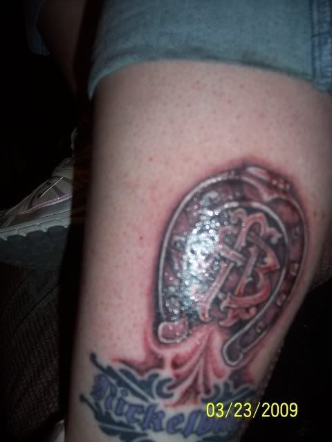  Dark Horse tattoo on my left leg above and joining my Nickelback tribal: