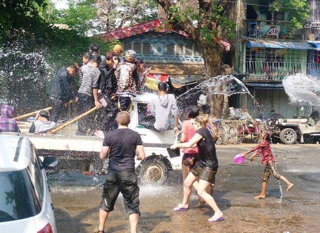 Water fight along Lower Pazundaung Road. Thanks to the wonderful staff of Motherland Inn! photo 10155742_10203269236519184_1672660787719065725_n.jpg