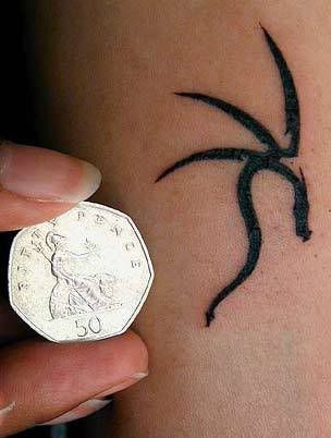 tribal frog tattoo. she got a tribal frog on
