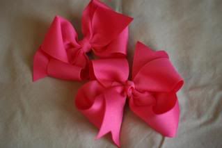 1 med hot pink boutique bow, and 1 med hot pink twisted boutique bow
