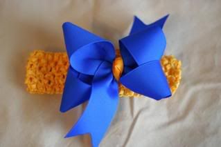 1 med. electric blue inside out bow with yellow gold knot