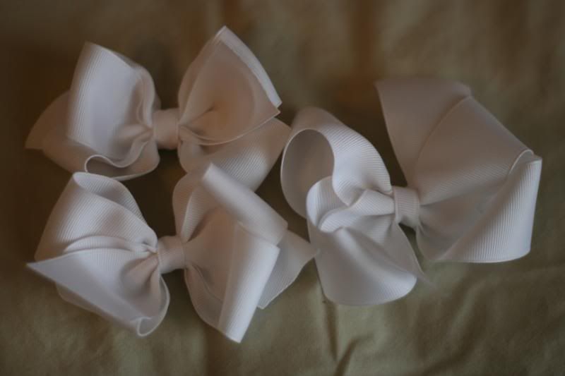 2 medium white boutique bows and 1 med. twisted boutique bow
