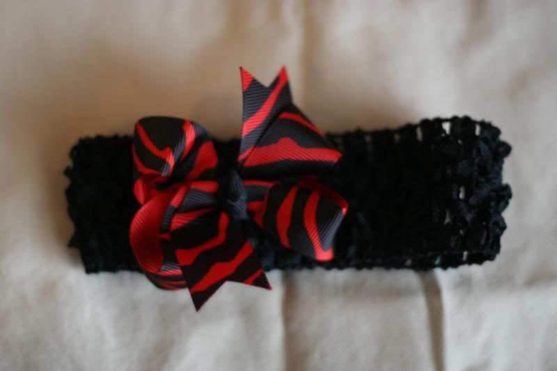 1 small red and black zebra print twisted boutique bow