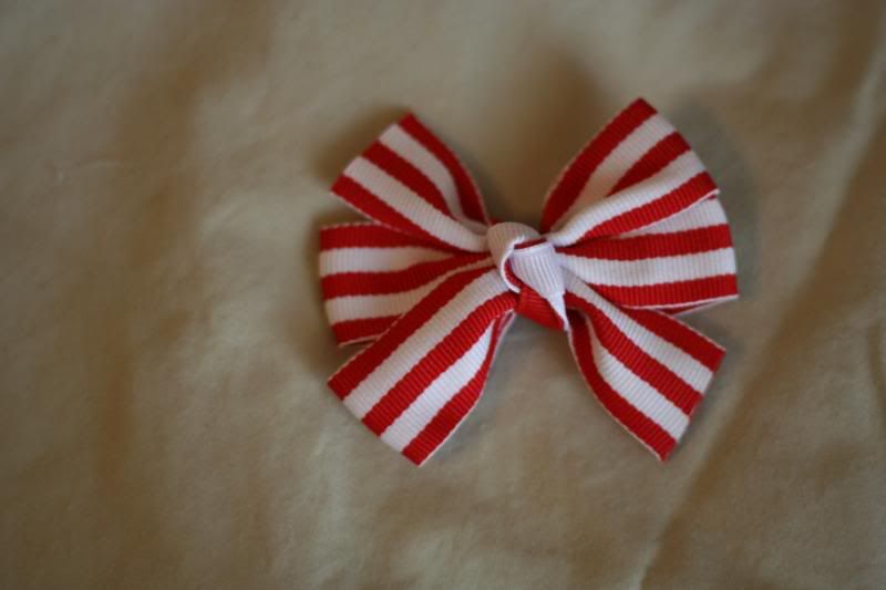 1 small red and white stripe pinwheel bow