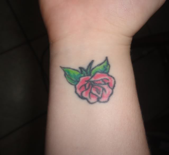rose tattoos on wrist for girls. I have a small pink rose tattooed on my wrist. I got it done a week after my 