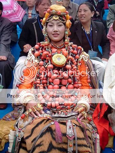 Girl from Tibet wearing a HUGE amount of real coral.